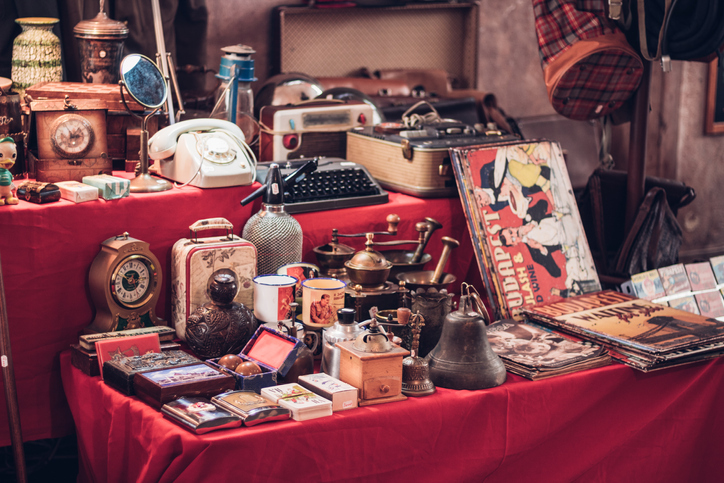 A bunch of collectibles sit on a display table