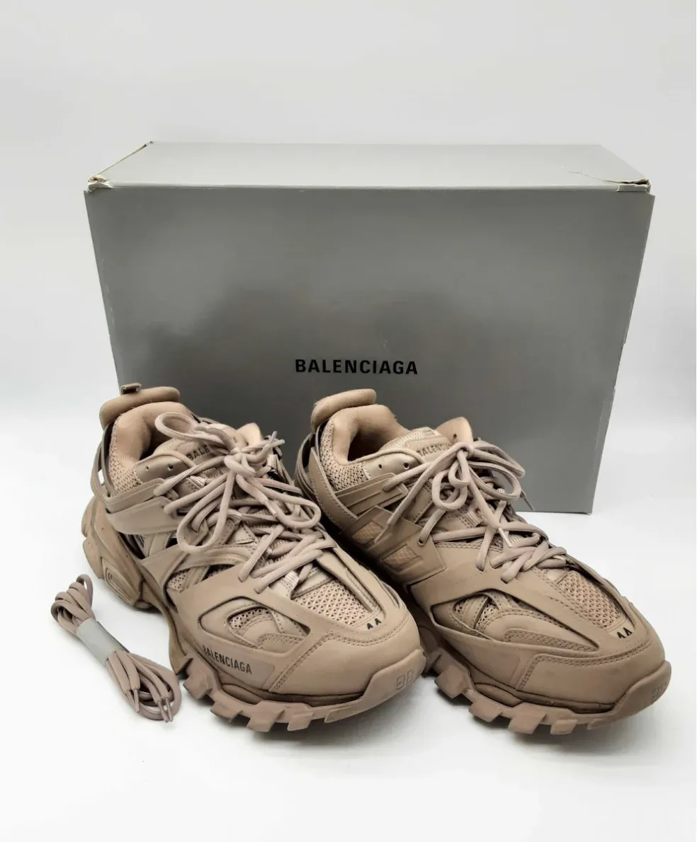 Beige Balenciaga sneakers with an accompanying box.