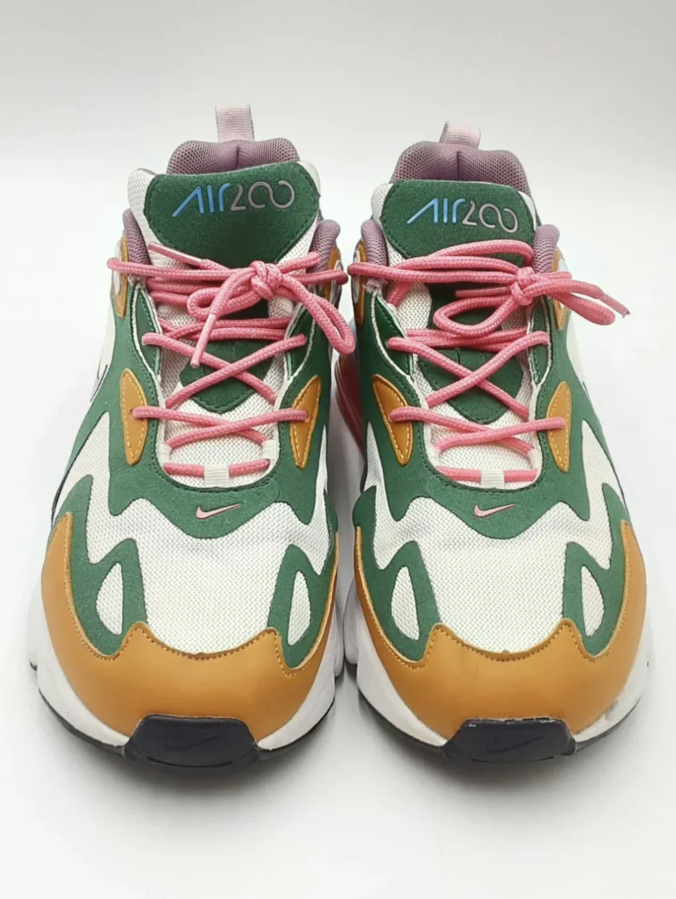 Nike Air 200 sneakers with green, white, brown, and pink color accents.