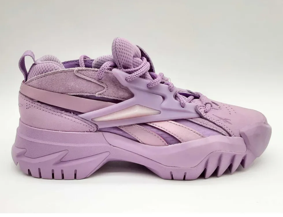 Purple Reebok sneakers with a rugged design.