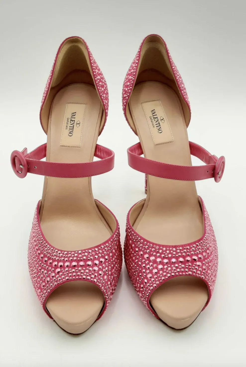 Pink studded high-heeled shoes by Valentino.